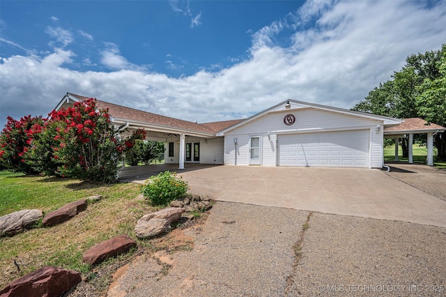 710 N Brethren Rd, Cushing, OK 74023 - single story home featuring an attached garage, concrete driveway, and french doors