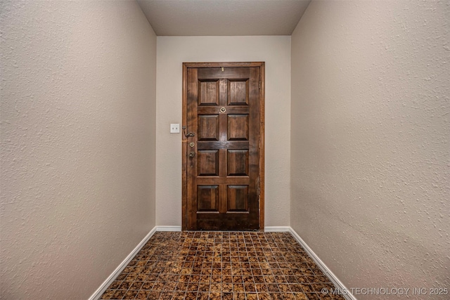 710 N Brethren Rd, Cushing, OK 74023 - entryway featuring baseboards and a textured wall