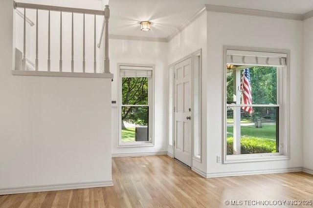 1620 S Florence Pl, Tulsa, OK 74104 - entryway with ornamental molding and wood finished floors