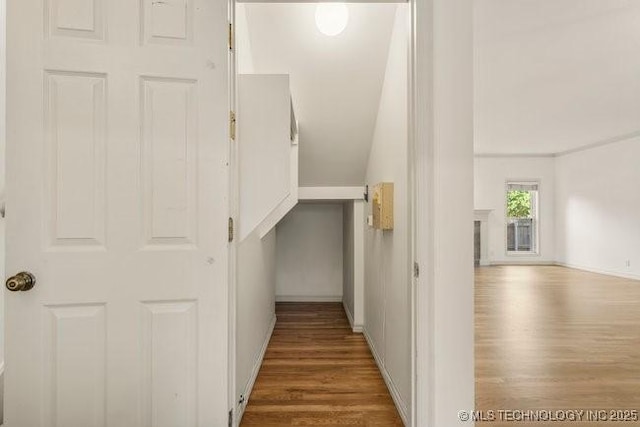 1620 S Florence Pl, Tulsa, OK 74104 - corridor featuring wood finished floors and vaulted ceiling