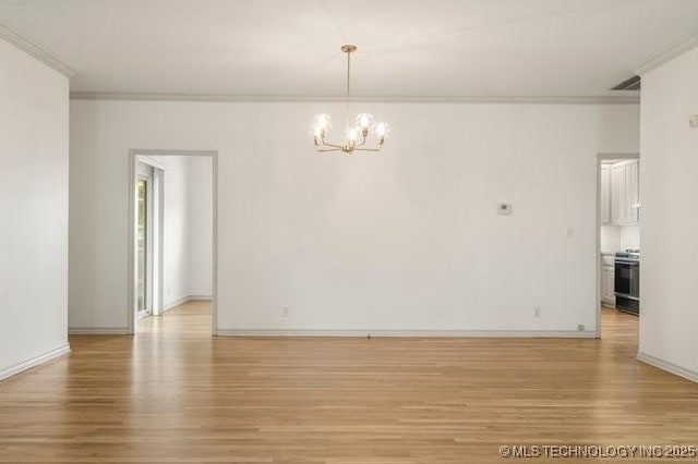 1620 S Florence Pl, Tulsa, OK 74104 - spare room featuring ornamental molding, light wood finished floors, and a chandelier
