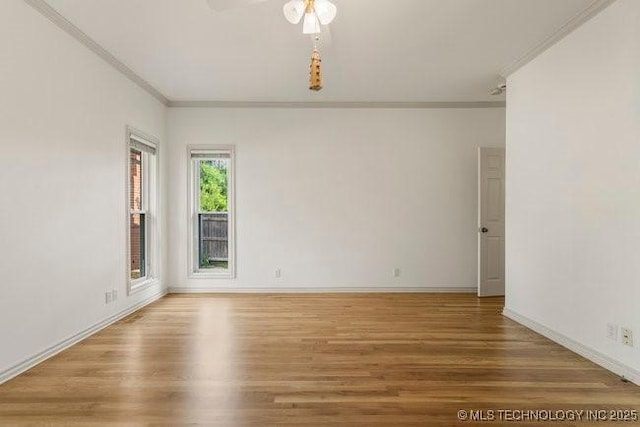 1620 S Florence Pl, Tulsa, OK 74104 - unfurnished room with crown molding, wood finished floors, and ceiling fan