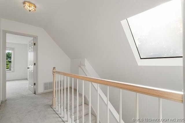 1620 S Florence Pl, Tulsa, OK 74104 - hall with an upstairs landing, vaulted ceiling, and light carpet