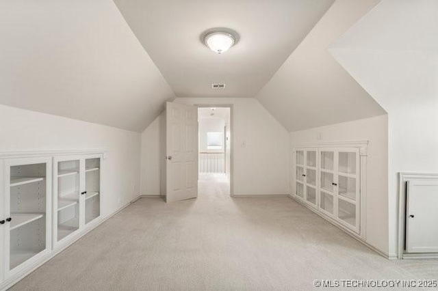 1620 S Florence Pl, Tulsa, OK 74104 - additional living space with carpet flooring and vaulted ceiling