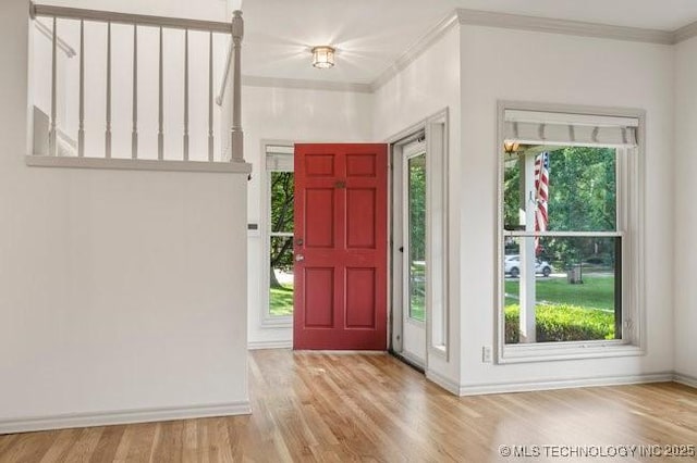 1620 S Florence Pl, Tulsa, OK 74104 - entrance foyer with wood finished floors and ornamental molding