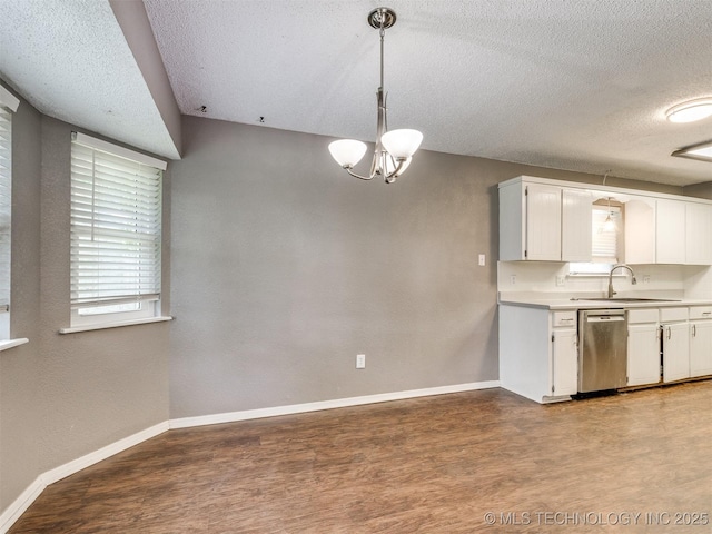 117 W Timberlane St, Broken Arrow, OK 74011 - kitchen featuring dishwasher, a textured ceiling, white cabinetry, light countertops, and a chandelier
