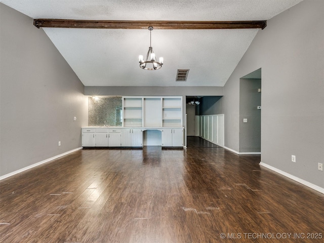 117 W Timberlane St, Broken Arrow, OK 74011 - unfurnished living room featuring a chandelier, a textured ceiling, and dark wood-style flooring