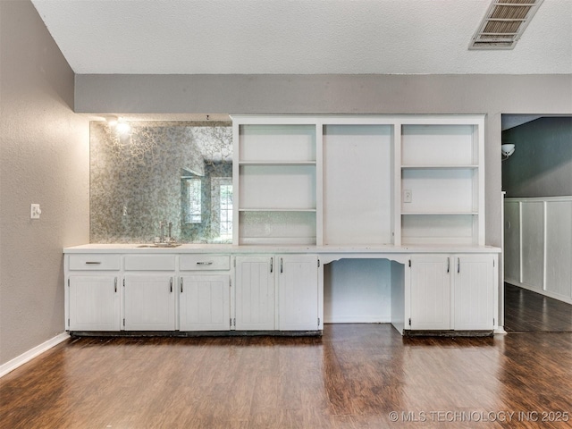 117 W Timberlane St, Broken Arrow, OK 74011 - interior space featuring dark wood-type flooring, a textured ceiling, and a textured wall
