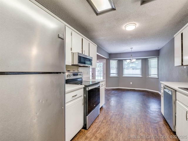 117 W Timberlane St, Broken Arrow, OK 74011 - kitchen with stainless steel appliances, dark wood-style flooring, white cabinets, a textured ceiling, and light countertops