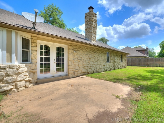 117 W Timberlane St, Broken Arrow, OK 74011 - rear view of house featuring stone siding, french doors, a patio area, and a chimney