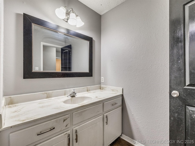 117 W Timberlane St, Broken Arrow, OK 74011 - bathroom featuring vanity, a textured wall, and a textured ceiling