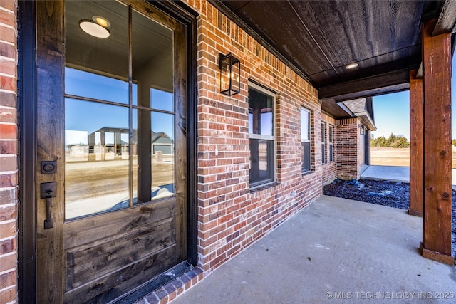 175 Maple Leaf Dr, Durant, OK 74701 - property entrance featuring brick siding and a porch
