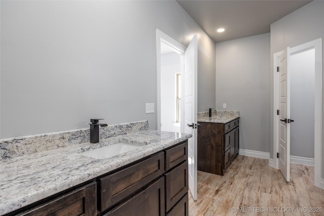 175 Maple Leaf Dr, Durant, OK 74701 - bathroom with vanity, wood finished floors, and recessed lighting
