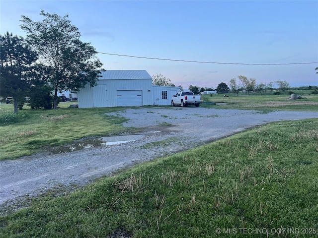 33803 S 4230th Rd, Inola, OK 74036 - view of yard featuring an outdoor structure, gravel driveway, a pole building, and a garage