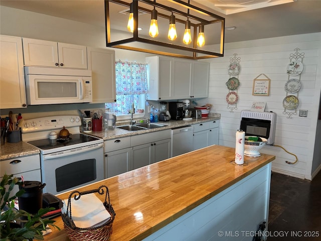33803 S 4230th Rd, Inola, OK 74036 - kitchen featuring white appliances, heating unit, wooden counters, decorative light fixtures, and white cabinetry