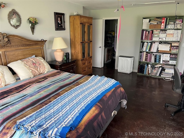 33803 S 4230th Rd, Inola, OK 74036 - bedroom featuring concrete flooring and a desk