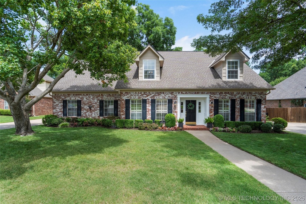 801 S Redwood Ave, Broken Arrow, OK 74012 - cape cod house featuring roof with shingles and brick siding