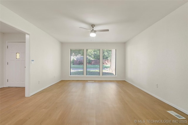 6905 S Redbud Ave, Broken Arrow, OK 74011 - unfurnished room with ceiling fan and light wood finished floors