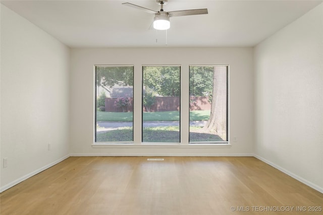6905 S Redbud Ave, Broken Arrow, OK 74011 - spare room featuring light wood-type flooring, healthy amount of natural light, and a ceiling fan