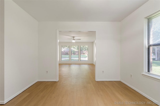 6905 S Redbud Ave, Broken Arrow, OK 74011 - unfurnished room with light wood-style flooring and ceiling fan