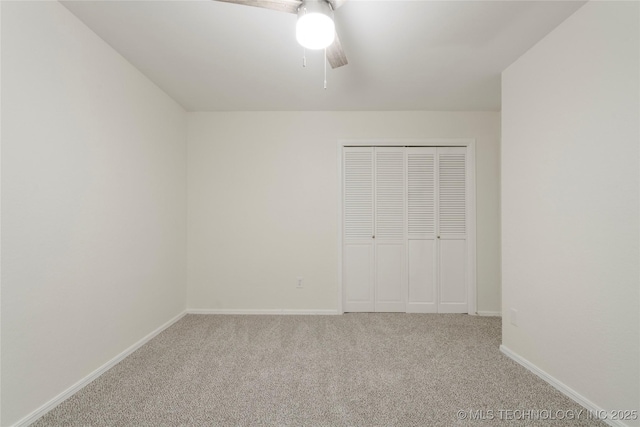 6905 S Redbud Ave, Broken Arrow, OK 74011 - unfurnished bedroom with carpet flooring, a closet, and a ceiling fan