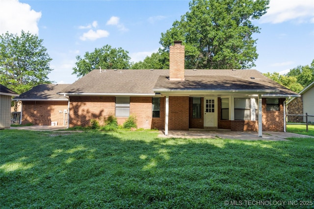 6905 S Redbud Ave, Broken Arrow, OK 74011 - rear view of house featuring a patio, brick siding, and a chimney