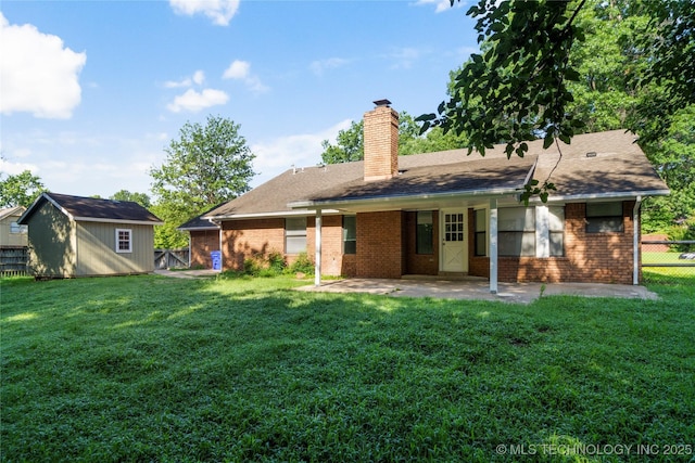 6905 S Redbud Ave, Broken Arrow, OK 74011 - rear view of property featuring a patio, brick siding, a chimney, a storage shed, and a shingled roof