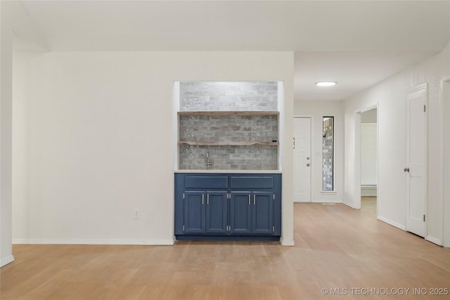 6905 S Redbud Ave, Broken Arrow, OK 74011 - unfurnished living room with light wood-style floors and bar area