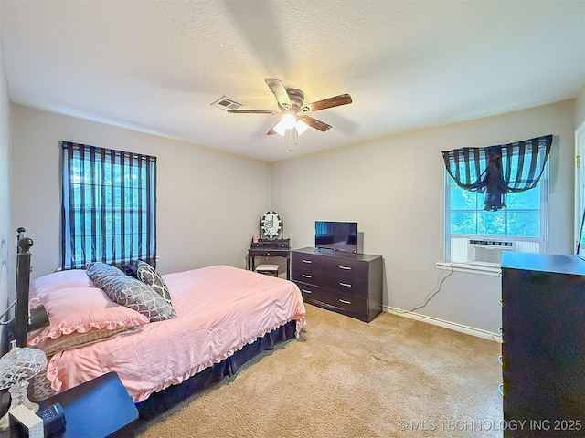 14174 County Road 3501, Ada, OK 74820 - bedroom featuring multiple windows, light carpet, cooling unit, and ceiling fan