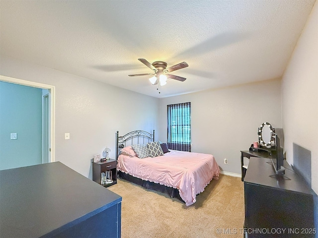 14174 County Road 3501, Ada, OK 74820 - bedroom featuring light colored carpet, a textured ceiling, and ceiling fan