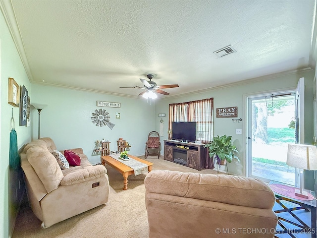 14174 County Road 3501, Ada, OK 74820 - living room featuring ornamental molding, ceiling fan, a textured ceiling, and light colored carpet