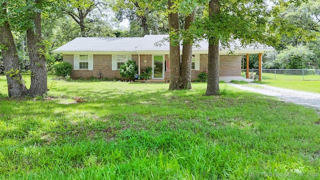 14174 County Road 3501, Ada, OK 74820 - single story home featuring dirt driveway, brick siding, and an attached carport
