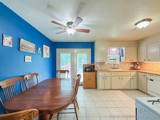14174 County Road 3501, Ada, OK 74820 - kitchen with white appliances, plenty of natural light, decorative backsplash, a textured ceiling, and a textured wall