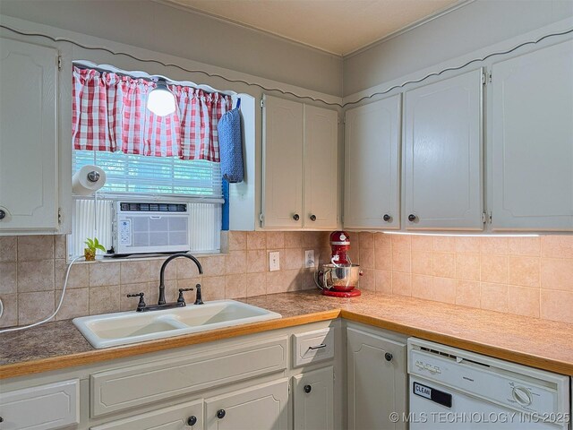 14174 County Road 3501, Ada, OK 74820 - kitchen with white dishwasher, white cabinetry, and backsplash