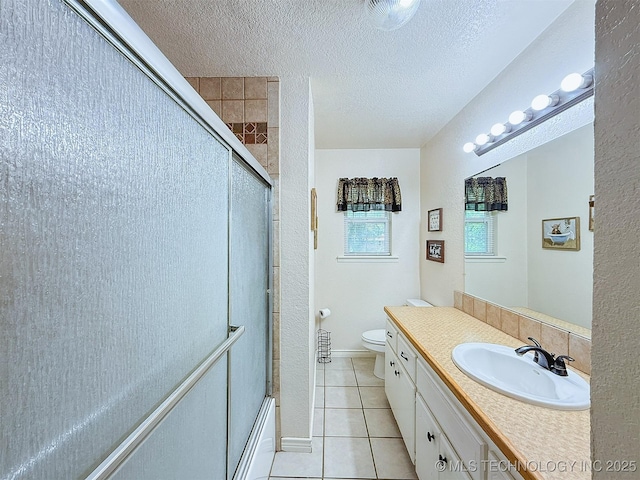 14174 County Road 3501, Ada, OK 74820 - full bathroom with tile patterned flooring, vanity, enclosed tub / shower combo, and a textured ceiling