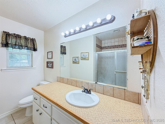 14174 County Road 3501, Ada, OK 74820 - full bath with tile patterned flooring, vanity, a stall shower, and a textured ceiling