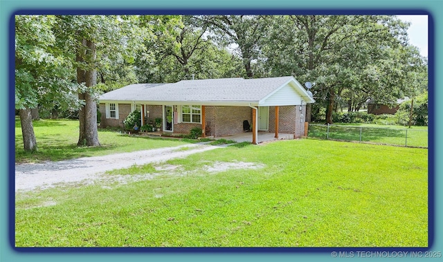14174 County Road 3501, Ada, OK 74820 - ranch-style home featuring brick siding, driveway, and a carport