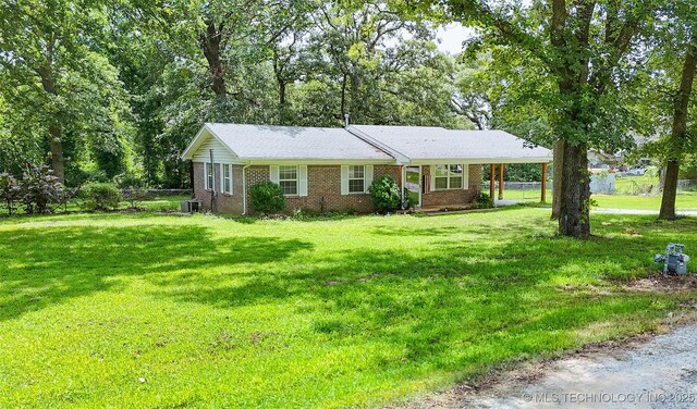 14174 County Road 3501, Ada, OK 74820 - single story home with brick siding and a carport