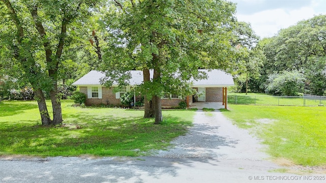 14174 County Road 3501, Ada, OK 74820 - view of front of house featuring brick siding and dirt driveway