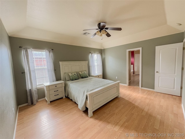 13155 E 132nd St N, Collinsville, OK 74021 - bedroom with light wood-style floors, a raised ceiling, and ceiling fan