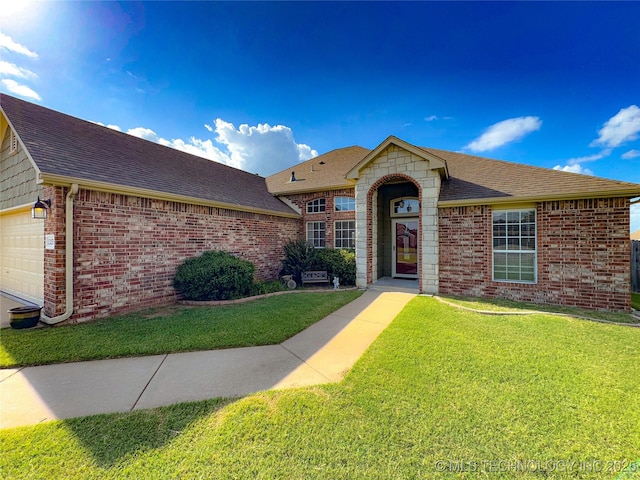 13155 E 132nd St N, Collinsville, OK 74021 - view of front of home with roof with shingles, a front lawn, brick siding, and an attached garage