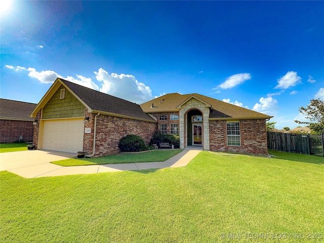 13155 E 132nd St N, Collinsville, OK 74021 - view of front of property featuring an attached garage, concrete driveway, brick siding, and a shingled roof