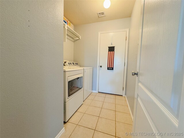 13155 E 132nd St N, Collinsville, OK 74021 - washroom featuring washing machine and dryer and light tile patterned floors