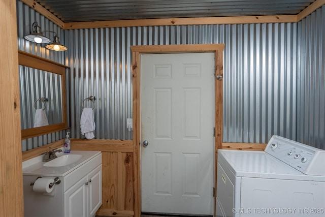 105074 N 3770, Okemah, OK 74859 - laundry area featuring washer / dryer, wallpapered walls, and cabinet space
