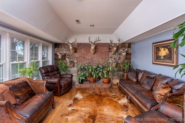 105074 N 3770, Okemah, OK 74859 - living room featuring wood finished floors and vaulted ceiling