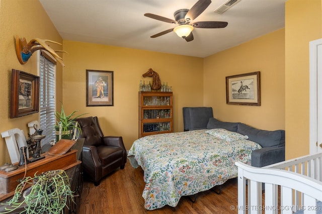 105074 N 3770, Okemah, OK 74859 - bedroom with wood finished floors and a ceiling fan