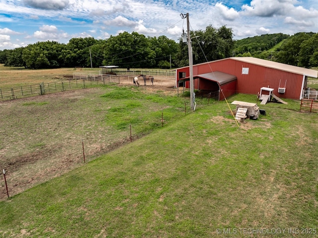 105074 N 3770, Okemah, OK 74859 - view of yard with a pole building, an outbuilding, a detached garage, an exterior structure, and a view of rural / pastoral area
