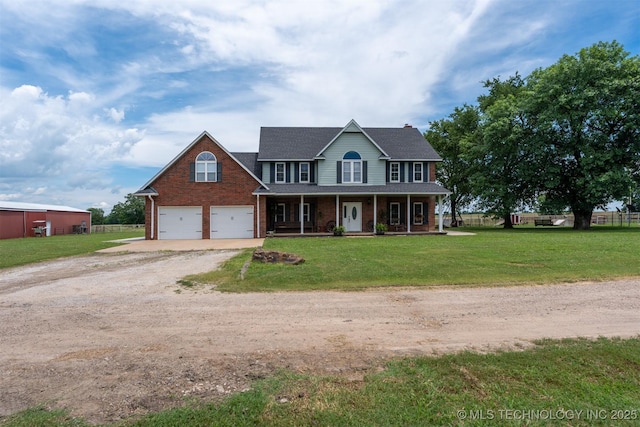 105074 N 3770, Okemah, OK 74859 - colonial home featuring a porch, driveway, brick siding, and a front lawn