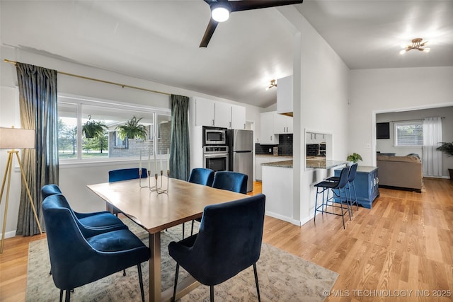 4620 S Winston Ave, Tulsa, OK 74135 - dining room with healthy amount of natural light, light wood finished floors, a ceiling fan, and vaulted ceiling