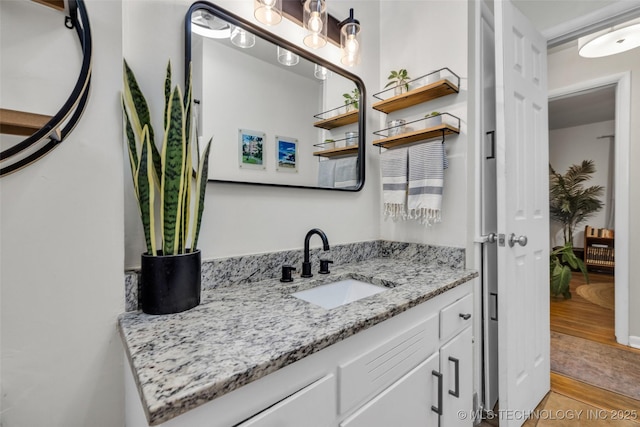 4620 S Winston Ave, Tulsa, OK 74135 - bathroom featuring vanity and wood finished floors